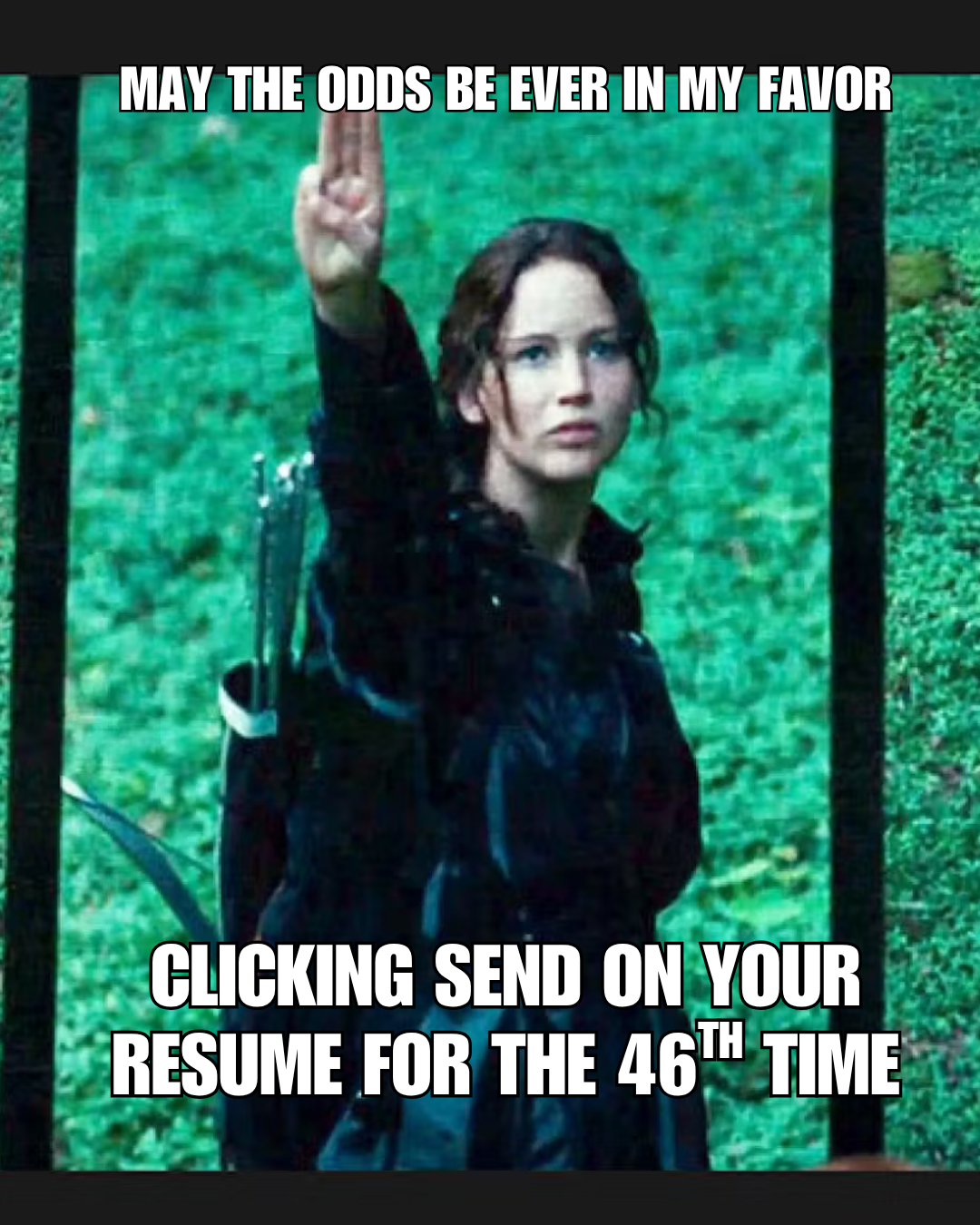 Katniss Everdeen from The Hunger Games, saluting.