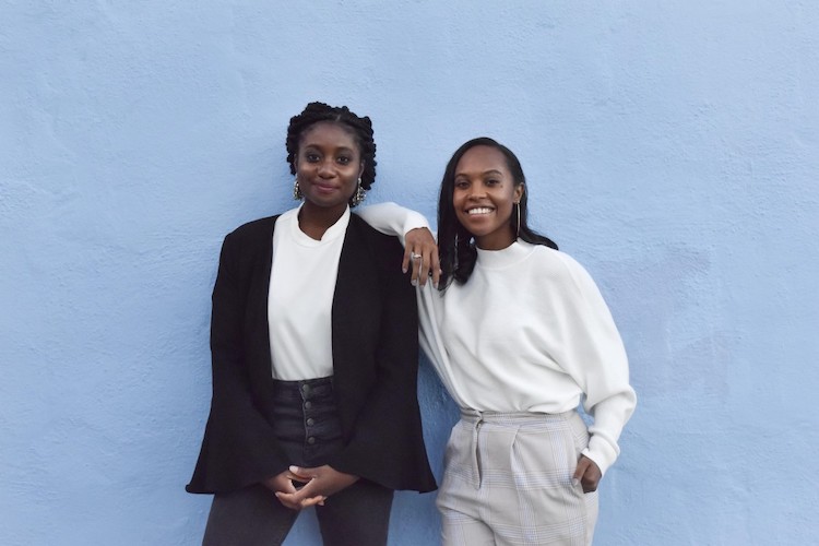 Erika and Arnelle posing together